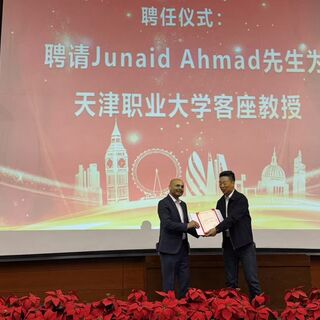 Junaid receiving award