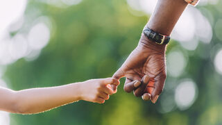 Grandfather holding hands with granddaughter