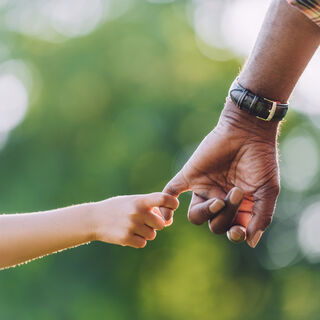 Grandfather holding hands with granddaughter